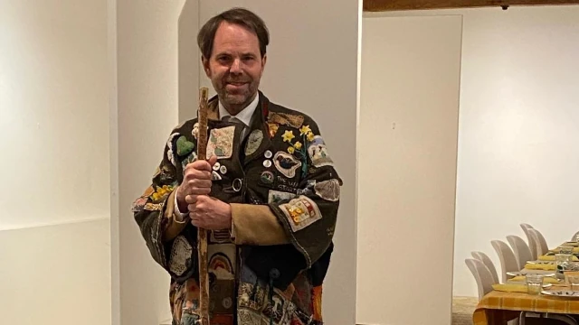 A photo of Rupert Read posing in the Coat of Hope.