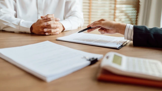 A close-up of two office workers having a meeting.