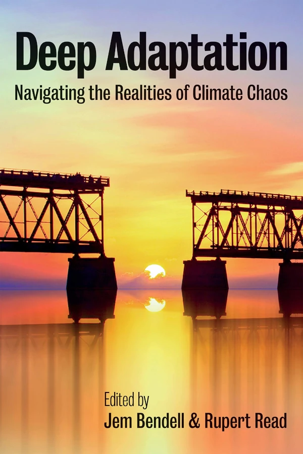 The cover of Deep Adaptation. It shows a photo of a railway bridge at sunset. There is a gap in the middle of the bridge, which is where the sun is going down. The subtitle is Navigating the Realities of Climate Chaos.