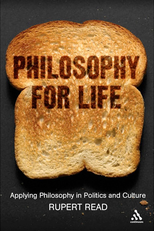 The cover of Philosophy for Life. It has a black background with a photo of a toasted slice of bread. The subtitle is Applying Philosophy in Politics and Culture.